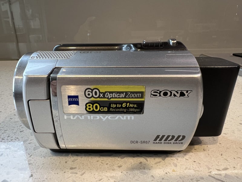 Sony Handycam DCR-SR67E 80GB, HDD 60X Optical Zoom, Up to 61 hrs Recording Carousel 1