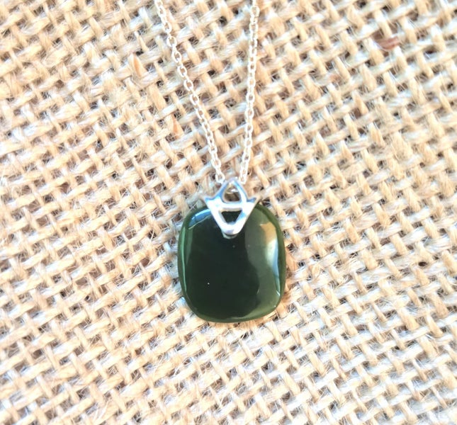 Pounamu pendant with sterling silver sitting and chain Carousel 1