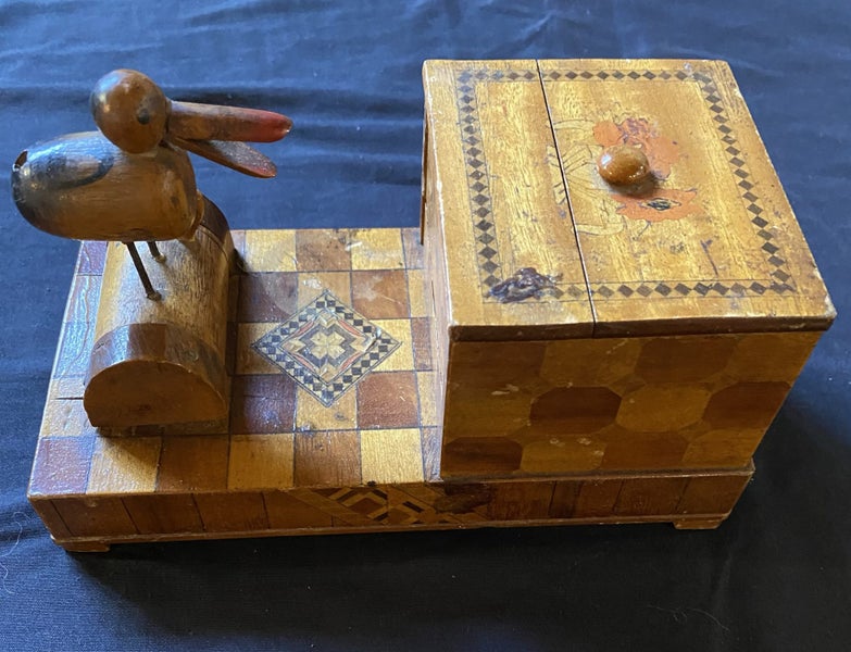 Old wooden cigarette box with bird on top Carousel 1