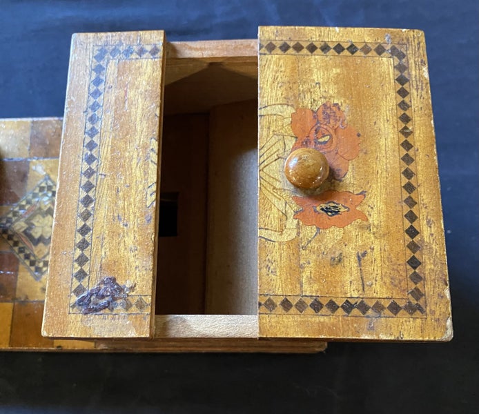 Old wooden cigarette box with bird on top Carousel 2