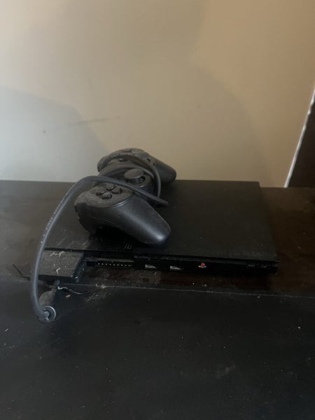 PS2 console x 7 games Carousel 1