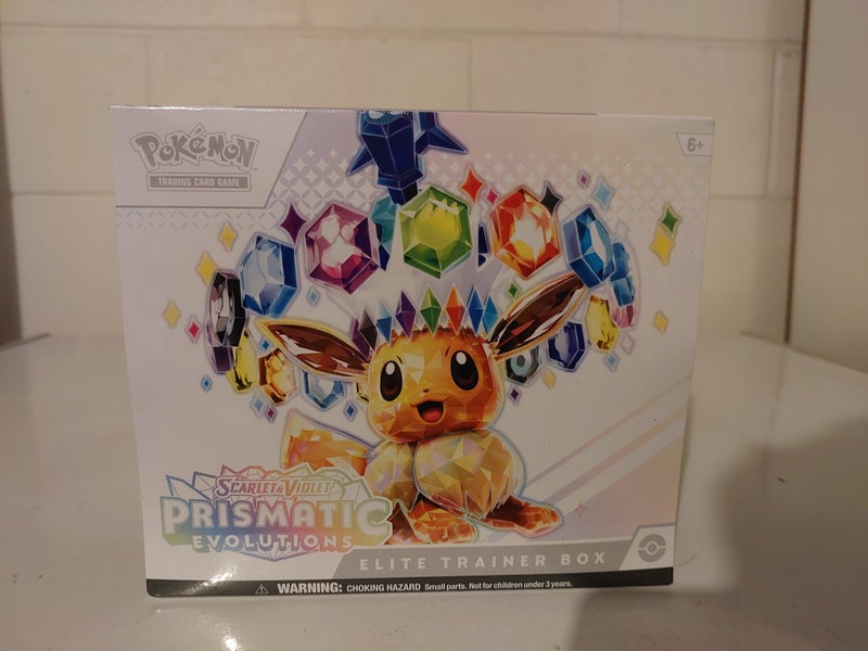 * $1 RESERVE * POKÉMON PRISMATIC EVOLUTIONS E.T.B Carousel 1