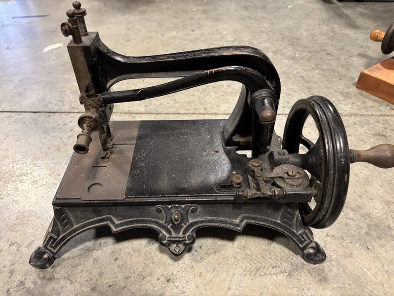 Three Antique Sewing Machines64031280950147110