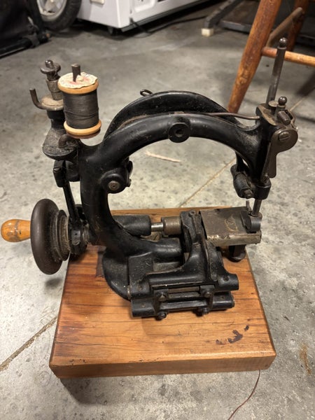 Three Antique Sewing Machines64031280950147111