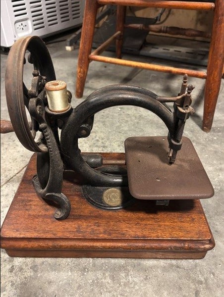 Three Antique Sewing Machines64031280950147112
