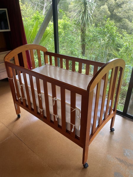 Touchwood cot includes Stokke bumper & waterproof sheets Carousel 1