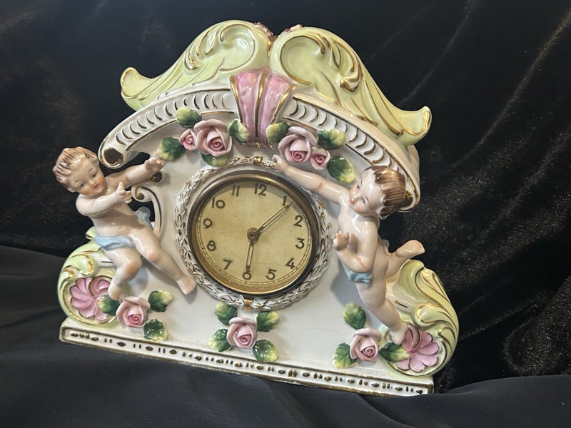 Vintage clock Porcelain Mantle Clock decorated with cherubs and floral motifs Carousel 2