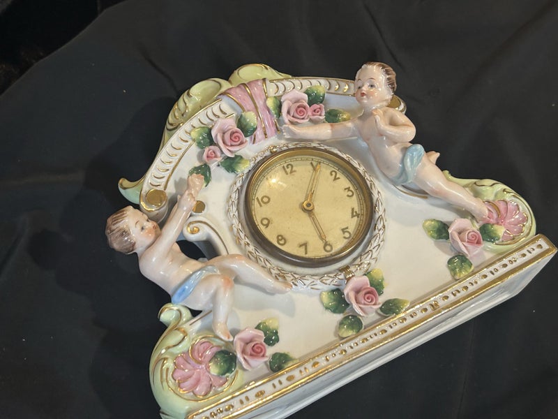Vintage clock Porcelain Mantle Clock decorated with cherubs and floral motifs Carousel 18