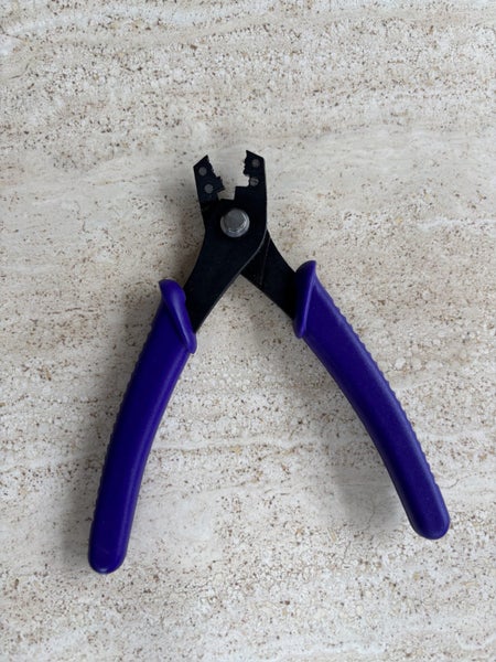 Plier, crimping, steel, purple and black, 5-3/8 inch multi-size tubes. Carousel 2