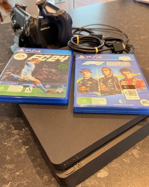 PS4 Slim 1TB with 2 Games, 2x Controllers & Double Charging Dock Carousel 1