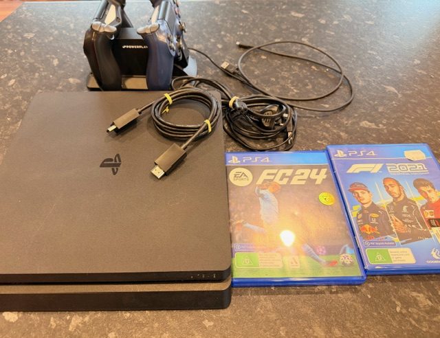 PS4 Slim 1TB with 2 Games, 2x Controllers & Double Charging Dock Carousel 4