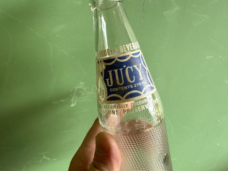 Vintage soda bottle Jucy Auckland made Carousel 2