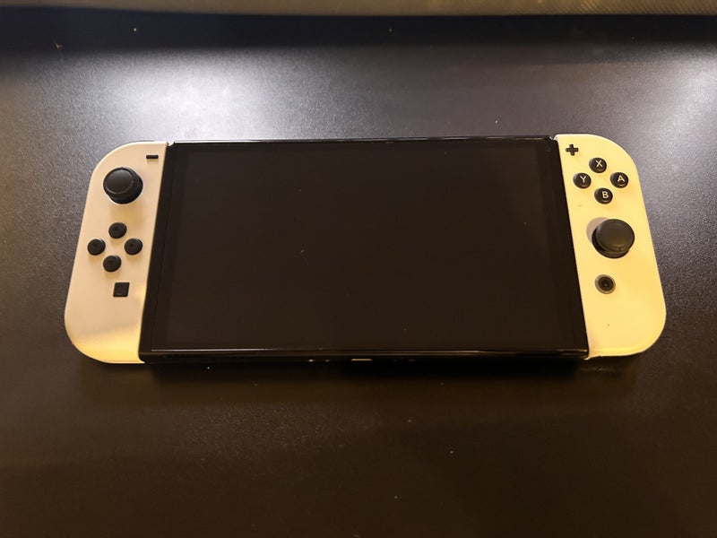 Nintendo Switch OLED + Pokemon Violet Carousel 1