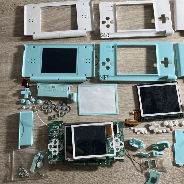 **Faulty** Nintendo DS Lite + 3rd Party Shell Carousel 2