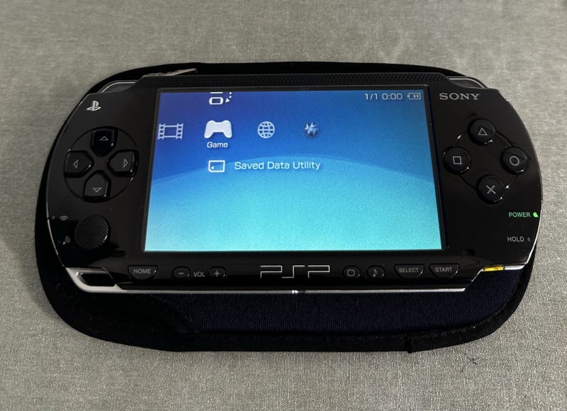 PSP 1000 – Piano Black | 64GB | Fully Set Up64142344263681111