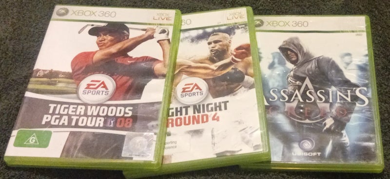 X3 XBOX 360 GAMES - FIGHT NIGHT, ASSASSIN'S CREED & TIGER WOODS Carousel 1
