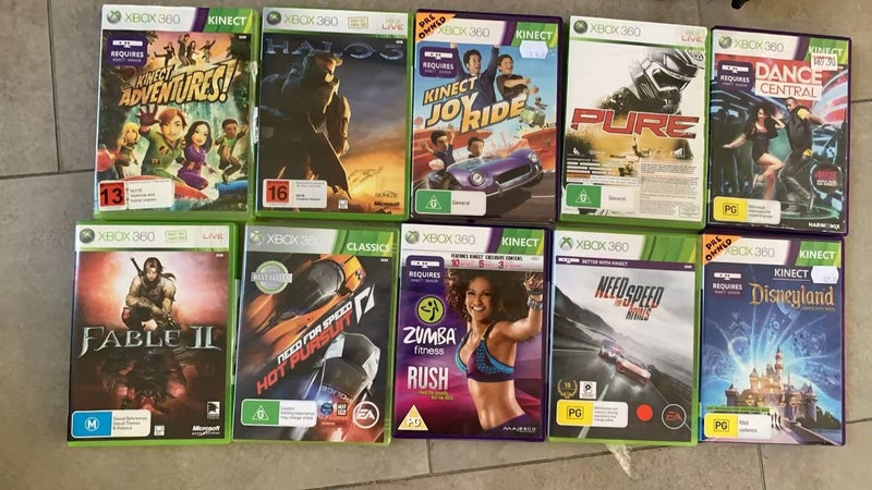 Xbox 360 with Kinect Sensor and 10 games and 2 controllers. Carousel 1
