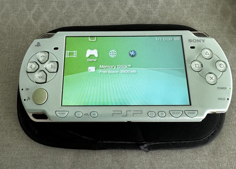 PlayStation Portable (PSP) 2000 – Mint Green | 64GB | Ready For Use64432529245185111