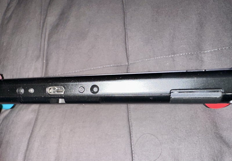 NEAR NEW condition Nintendo Switch - black vinyl & comes with case Carousel 16