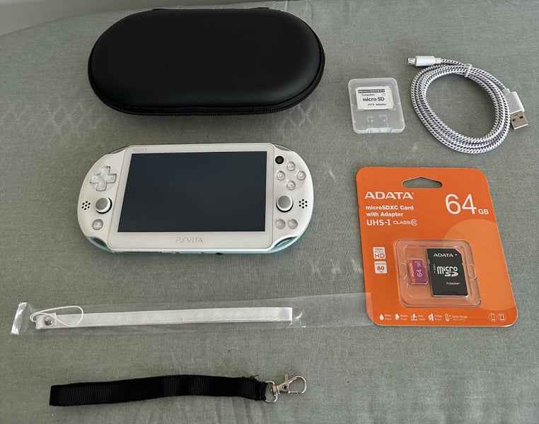 PS Vita 2000 – White / Light Blue | 64 GB | Fully Set Up64366767971715110