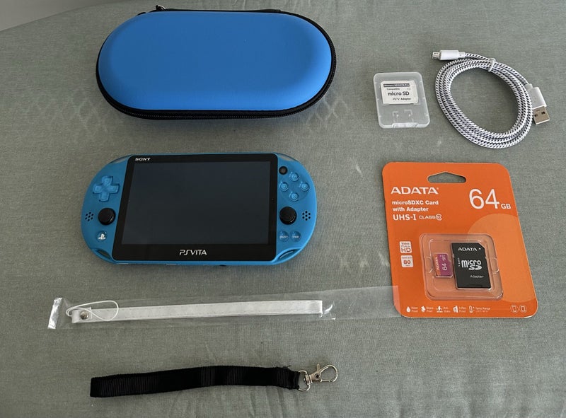 PS Vita 2000 – Aqua Blue | 64 GB | Fully Set Up64366665502211110