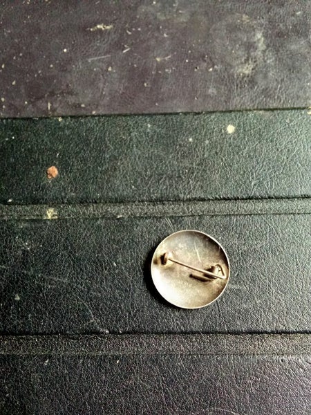 Silver pin badge. Carousel 2