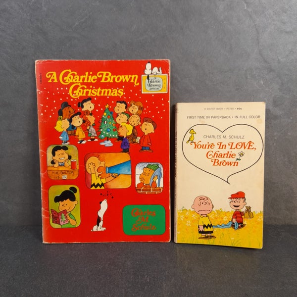 A Charlie Brown Christmas & First paperback ed. of You're in Love Charlie Brown Carousel 1