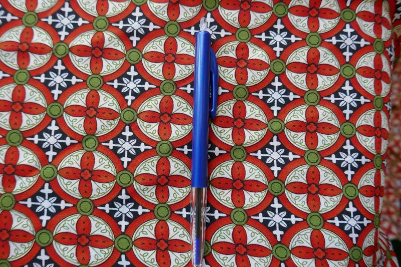 Orange -green main colours dress length Carousel 3