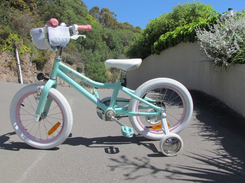 Childs bike with trainer wheels. Carousel 1
