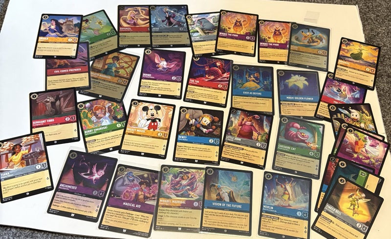 $1 res Huge Disneys Lorcana bundle! Including chapter 1 legendary! Carousel 13
