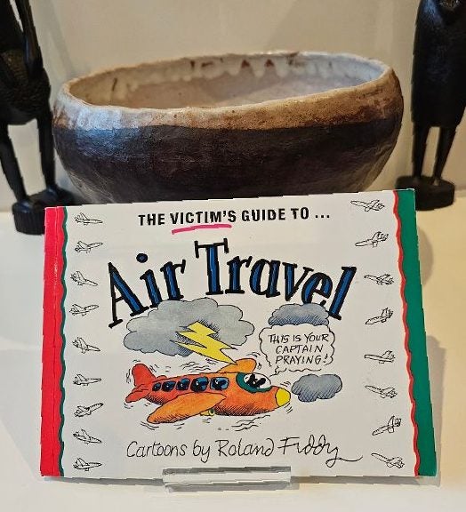 The Victim's Guide to Air Travel by Roland Fiddy. "This is your pilot praying". Carousel 1