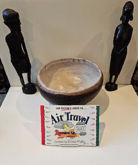 The Victim's Guide to Air Travel by Roland Fiddy. "This is your pilot praying". Carousel 3