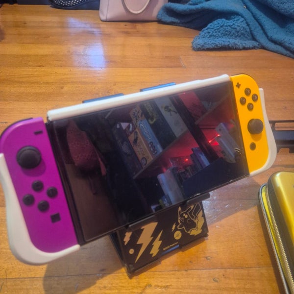 Nintendo Switch OLED + accessories + controllers + mics Carousel 1