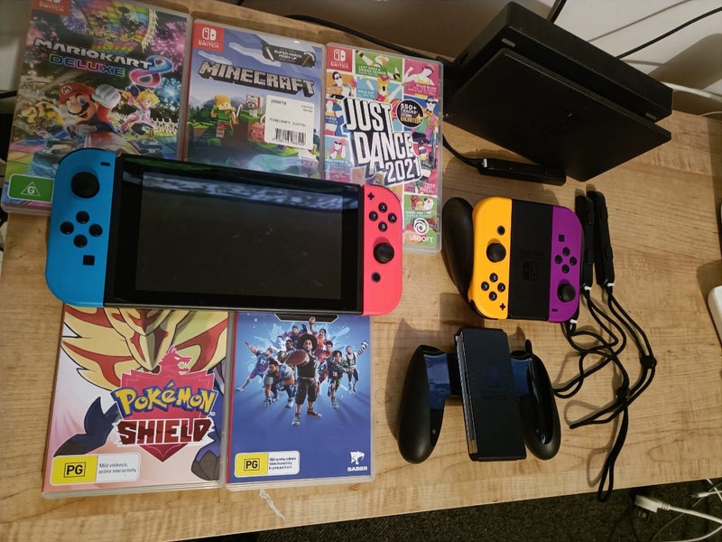 Nintendo switch with games and accessories Carousel 1