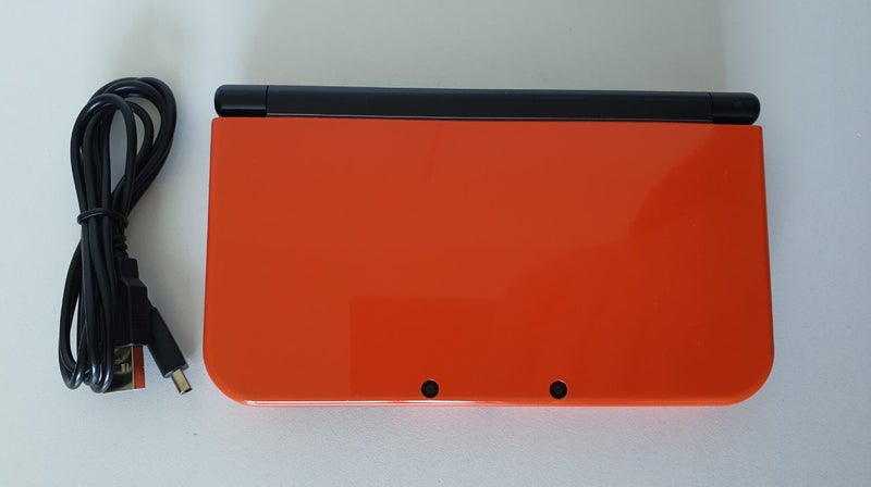 New Nintendo 3DS XL Orange + Black Carousel 1