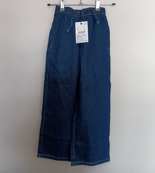Zara Kids denim jeans with a paperbag waist and drawstring. Carousel 2