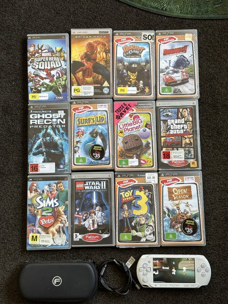 PSP E1002 with 11 games and case Carousel 1