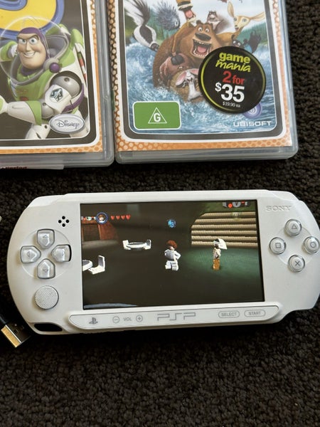 PSP E1002 with 11 games and case Carousel 2
