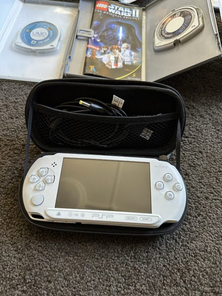 PSP E1002 with 11 games and case Carousel 8