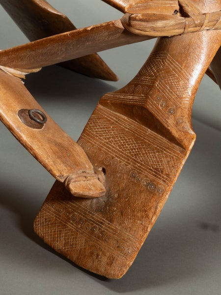 Camel saddle. Wood, hide thongs. Hand-woven trappings. Carousel 5