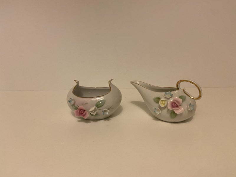 Vintage porcelain creamer and sugar bowl set Carousel 1
