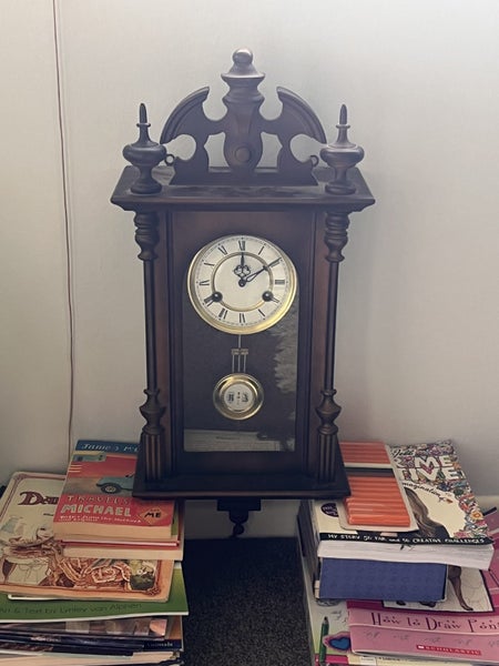 Schmidt Striking Wall Clock with Pendulum Carousel 1