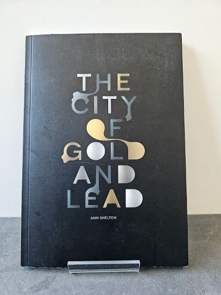 The City of Gold and Lead by Ann Shelton. Softcover as New. Carousel 1