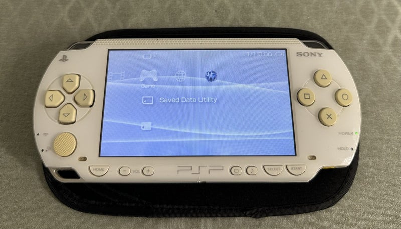PSP 1000 – Ceramic White | 64GB | Fully Set Up64694819922947111