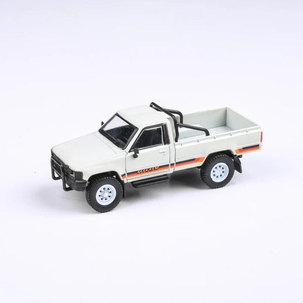 PARA64 1:64 1984 Toyota Hilux Single Cab White Carousel 1