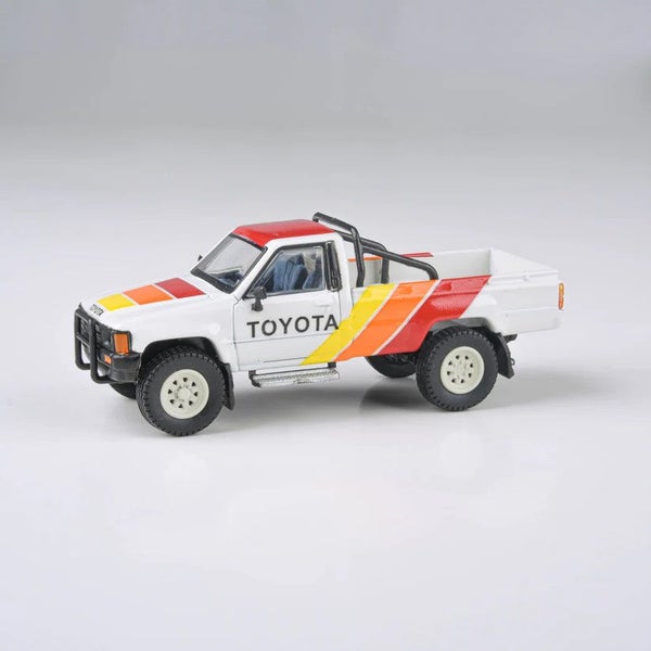 PARA64 1:64 1984 Toyota Hilux Single Cab TRD Pro Ironman Carousel 1