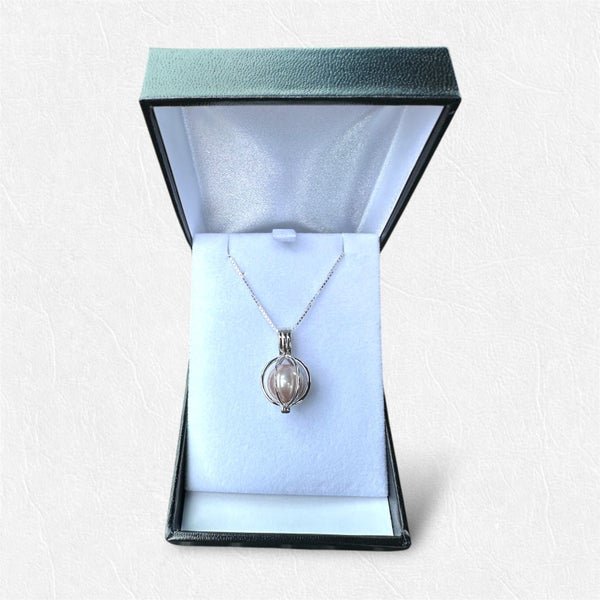 Captured Moment Necklace - Sterling Silver Cage Necklace with Pink Edison Pearl Carousel 1