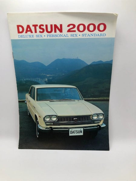 Datsun 2000 deluxe six . Personal six. Standard by Nissan Motor Co Carousel 1