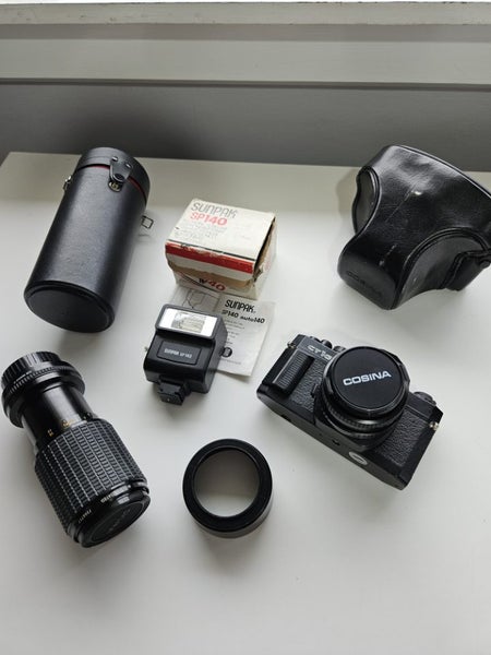Cosina CT1G SLR Camera, + Sigma Zoom-K II Lens + Sunpak SP140 Flash Carousel 1
