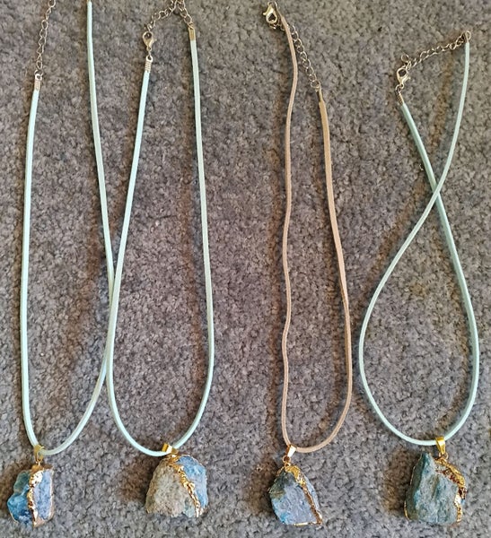 BLUE STONE PENDANT WITH GOLD FOIL TRIM ON BLUE SUEDE CORD Carousel 1